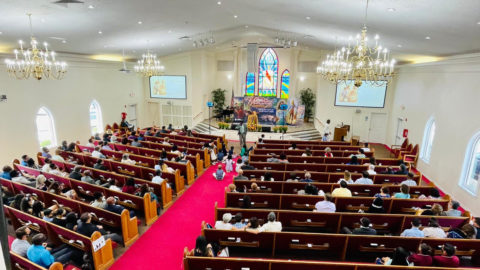 people sitting in church at evangelistical meeting