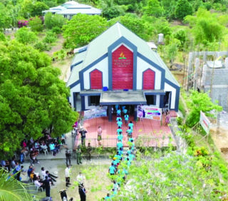 Adventist church with people walking towards