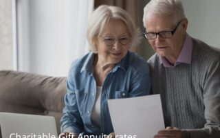 elderly husband and wife overseeing charitable gift annuity in the comfort of their home